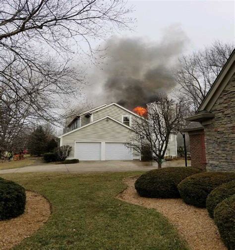 Video: Fire crews scramble to safety as fireball bursts through roof of home  